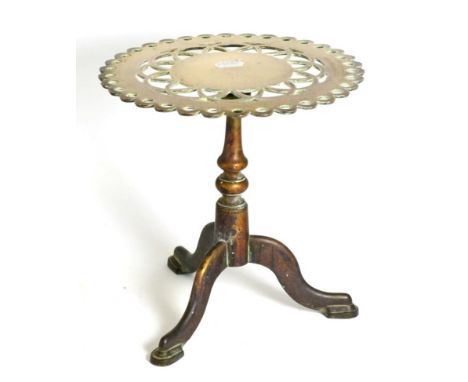 A Victorian Brass Trivet, in the form of a tripod table with hinged, pierced circular top, 29cm high