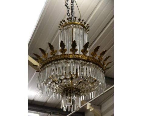 A Gilt Metal and Cut Glass Seven-Light Electrolier, cast with leaves and hung with faceted drops, approx 65cm high
