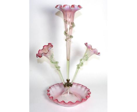 A Pink Vaseline Glass Epergne, with frilled rims, the central trumpet vase flanked by two further vases, on a circular base, 