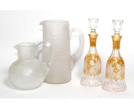 A Pair of Amber Overlay Clear Glass Scent Bottles and Stoppers, early 20th century, engraved with foliage; Two Pairs of Regen