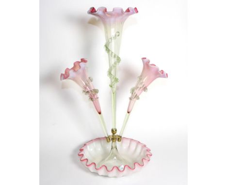 A Pink Vaseline Glass Epergne, with frilled rim, the central trumpet vase flanked by two further vases, on a circular base, 5