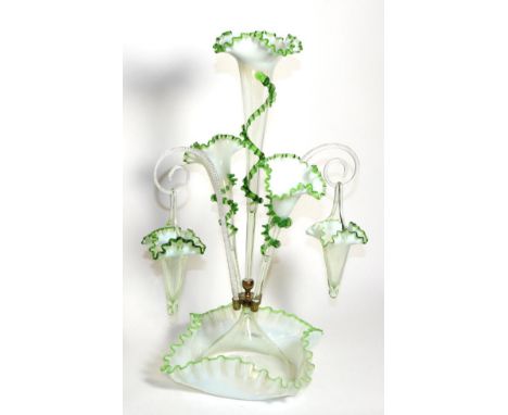 A Green Vaseline Glass Epergne, with frilled rims, the central trumpet vase flanked by two further trumpet vases and two bask