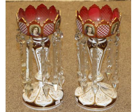 A Pair of Bohemian White Overlay Ruby Glass Lustres, circa 1870, the castellated bowls painted with bust portraits of girls a