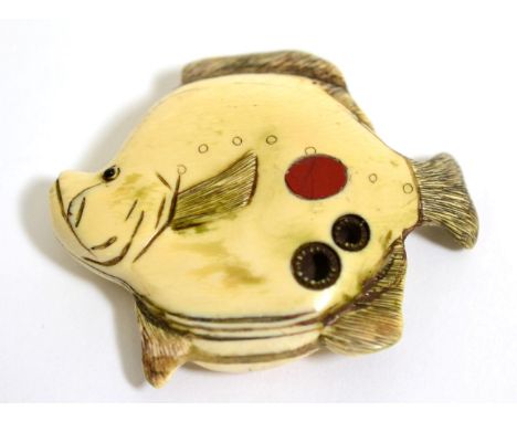 A Japanese Ivory Netsuke, signed Tomoichi, Meiji period, as a flat fish, 6cm long