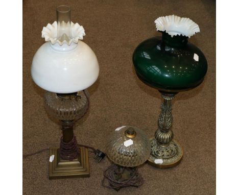 A Brass Oil Lamp, with green overlay white glass shade, cut glass reservoir and fluted column on a stepped square base, 63cm 