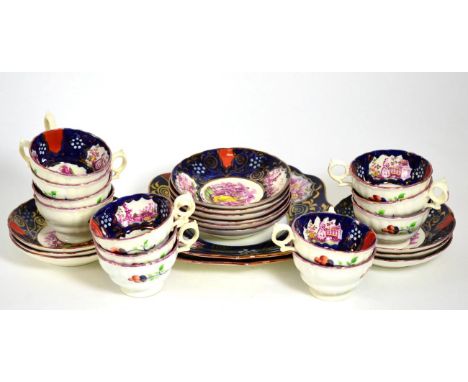 A Queen Victoria Commemorative Tea Service, printed in puce with THE ROYAL FAMILY and similar vignettes on a blue ground with
