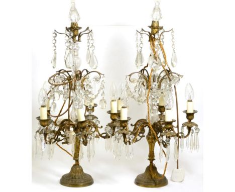 A Pair of Gilt Metal and Glass Five-Light Candelabra, in George III style, with scroll branches hung with faceted swags and d