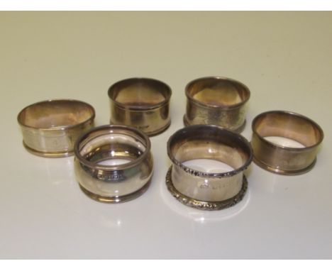 Six assorted silver napkin rings, two engine turned, two of plain form, one with engraved decoration and a further example by