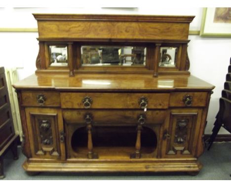 Victorian pollard oak open sideboard, three bevelled mirrors to the back, turned supports to angled shelf, base enclosing two