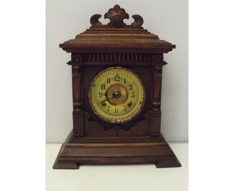 Ansonia eight day mantel clock, with old trade label inside back door, oak case and gilt dial, in excellent order, height 16.