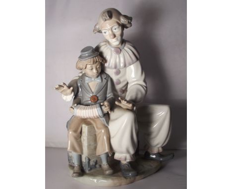 Large Nao figure of a clown with boy, 30cm in height