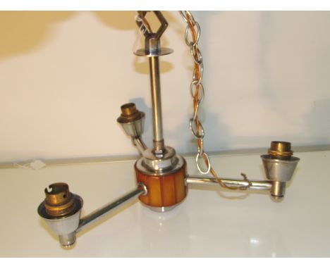 A art deco chrome and butterscotch bakelite ceiling light with three glass shades. Shade diameter 20 cm, fitting length/width