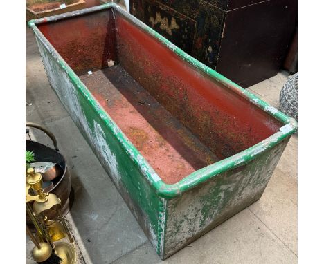 A large galvanised trough 