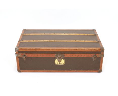 A vintage Louis Vuitton cabin trunk, opening to reveal two folding compartments and hanging space, the lock plate numbered 53