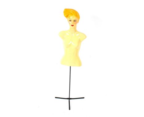 A 1970's plastic and metal mannequin on stand
