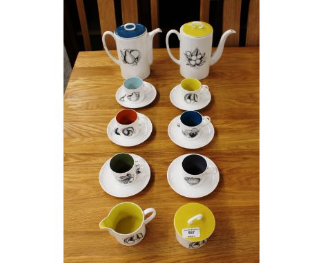 A Susie Cooper bone china coffee set, comprising coffee pot, hot milk jug, cream jug, covered sucrier and six coffee cans and