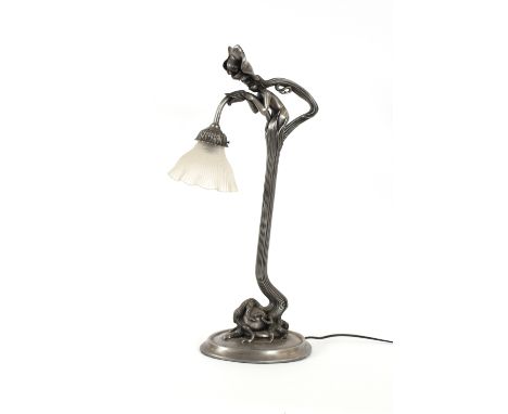 An Art Deco design silvered table lamp, of pixie and floral design with frosted glass shade, 65cm high overall