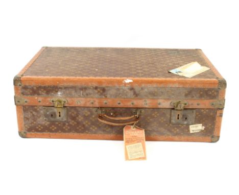 A vintage cabin trunk, stamped Aux Etats Unis, 229 Rue St Hondre, Paris, fitted folding compartments attached Cunard luggage 