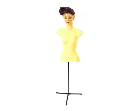 A 1970's plastic and metal mannequin on stand