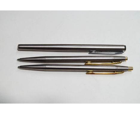A Montblanc Noblesse slim fountain pen with brushed steel case, and two matching roller ball pens