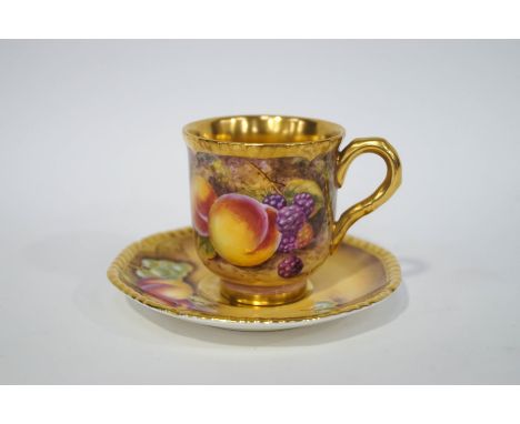 A Royal Worcester cabinet cup and saucer painted with fruit, signed S.Drysdale, printed factory marks.