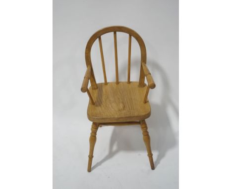 A miniature stick back childs chair with solid ash seat, on turned legs linked by an H stretcher, 59.5cm high