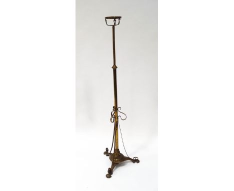 An Edwardian brass telescopic standard oil lamp stand, 148cm high.