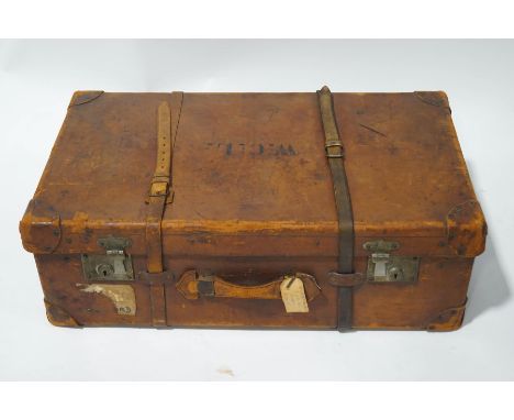 A vintage leather steamer trunk with black interior, including a drop-in tray and clasped pouch, 81cm wide,  (key at Receptio