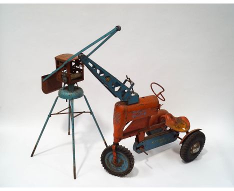 A vintage Tri-ang child's pedal 'Super Tractor' and a related farm crane, both in un-restored condition