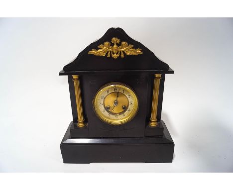 A Victorian slate eight day mantel clock, of architectural form, with pendulum and key, 38cm high