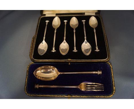 A cased set of six silver seal top tea spoons, Birmingham 1936; with a cased seal top silver spoon and fork christening set; 