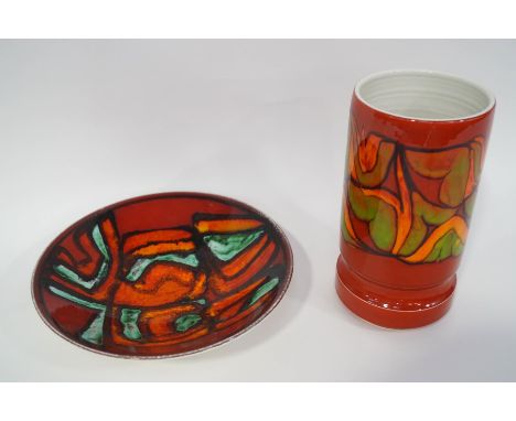 A Delphis Poole Pottery vase, impressed and painted marks to base, number 84, 24cm high, and a similar dish, number 57, 26.5c