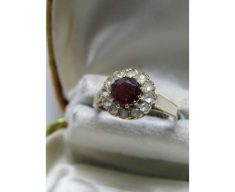 9ct YELLOW GOLD GARNET DRESS RING, central garnet surrounded by accent white stones, size L 