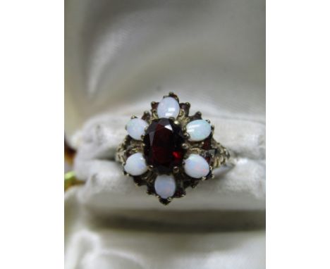 9ct GOLD GARNET &amp; OPAL CLUSTER, central oval cut garnet, surrounded by 6 cabouchon cut oval opals, size O/P 