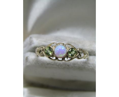 9CT YELLOW GOLD OPAL &amp; PERIDOT RING; in fancy heart design shank, size 'L/M' 