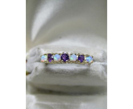 9CT YELLOW GOLD OPAL &amp; AMETHYST ETERNITY STYLE RING; Size 'L/M', 2 grams in weight 