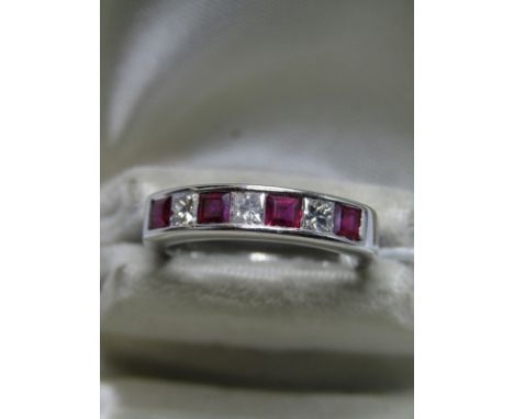 18ct WHITE GOLD RUBY &amp; DIAMOND ETERNITY RING, 7 stone ruby &amp; diamond eternity ring, set with 4 well matched princess 