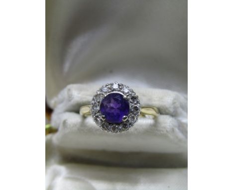 18ct YELLOW GOLD AMETHYST &amp; DIAMOND RING, central round brilliant cut amethyst surrounded by a halo of accent diamonds, s