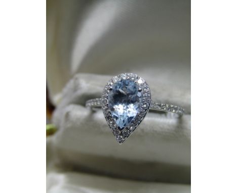 18CT WHITE GOLD AQUAMARINE &amp; DIAMOND RING; Central pear cut aquamarine of approx 1.5ct surrounded by halo of brilliant cu