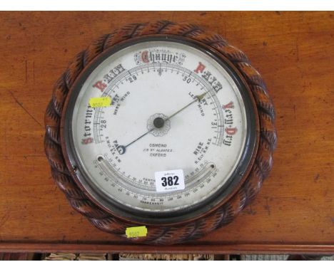 BAROMETER, circular barometer by Horsman with white enamelled dial &amp; Thermometer below in a carved rope design circular m