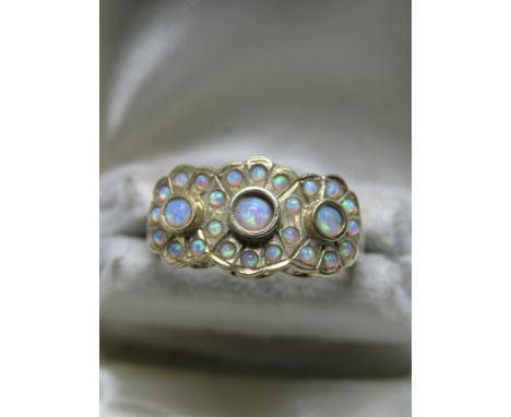 9CT YELLOW GOLD TRIPLE OPAL CLUSTER RING; 5.4 grams in weight, size 'O/P' 