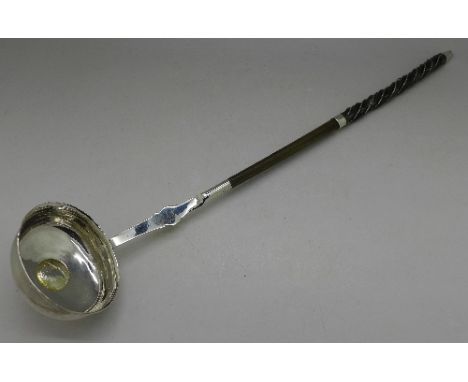 A silver toddy ladle inset with coin, length 37cm