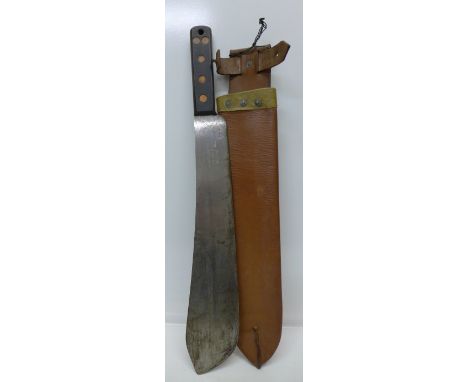 A machete with scabbard, the blade marked S&J Kitchin Ltd., Sheffield, No. 2640, also marked with broad arrow and 1955, scabb