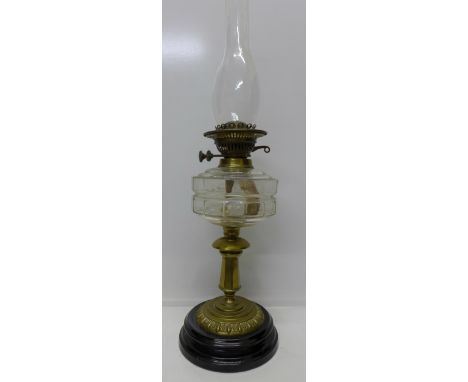 An early 20th Century oil lamp, lacking shade