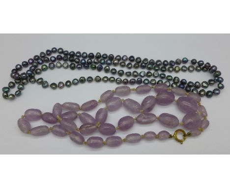 A cultured black pearl necklace and an amethyst necklace