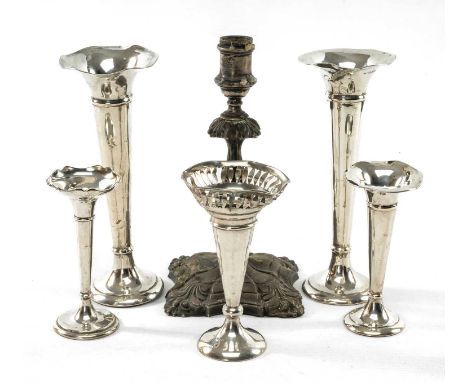 GROUP OF SILVER comprising an Edward VII single candlestick (loaded), Sheffield 1905, together with five similar loaded silve