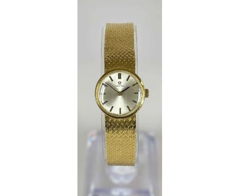 18CT GOLD LADIES' OMEGA BRACELET WATCH, c. 1965, manual wind movement with signed silvered dial, applied black filled baton h