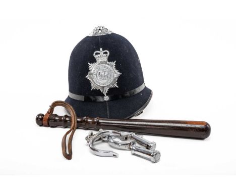 WELSH POLICE ENSEMBLE, comprising helmet with early 'South Wales Constabulary' badge, hardwood truncheon and steel cuffs (no 