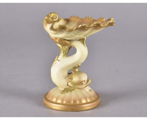 A Royal Worcester blush ivory dolphin and shell comport with green factory mark to base no 49, 10.5 cm high