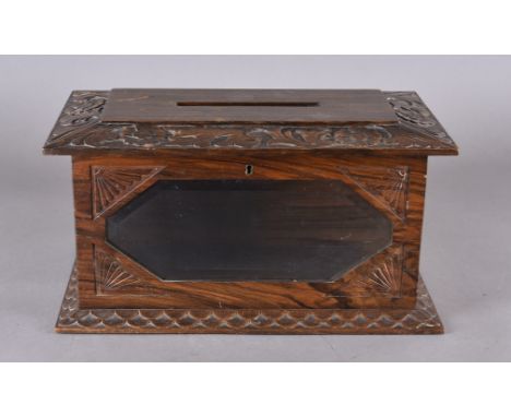 A late 19th Century rosewood country house letter box, having carved floral surround with glazed front with bevelled glass, t